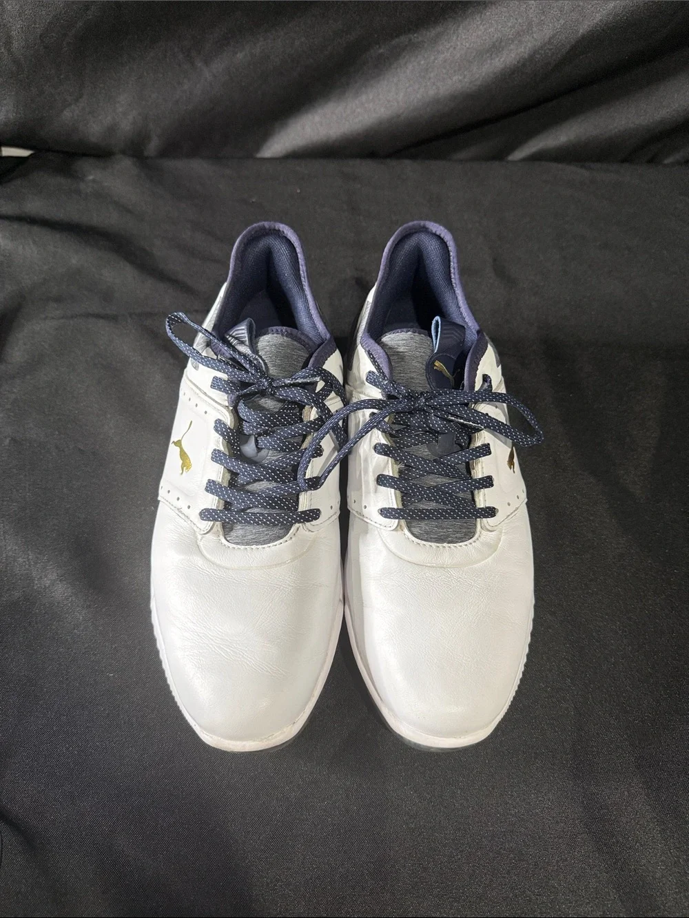 Puma men’s White and Navy Athletic Golf Shoes with Gold Logo